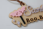 Close-up of pink bat and personalized acrylic name on a wooden Boo Basket Halloween tag for kids
