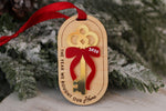 Wooden first Christmas in our new home ornament featuring a gold acrylic key, red bow with 2026 date, and engraved housewarming keepsake message.