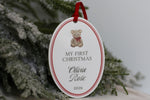 Personalized Baby's First Christmas 2026 ornament featuring a vintage teddy bear, Olivia Rose's name, red border and velvet ribbon on white acrylic.