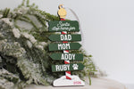 Personalized family Christmas ornament 2026 with green Santa Stop Here sign, custom family names, pet paw print, and wooden North Pole design