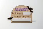 Personalized Halloween costume photo prop with child’s name, black bats and dry erase spaces for the year and costume