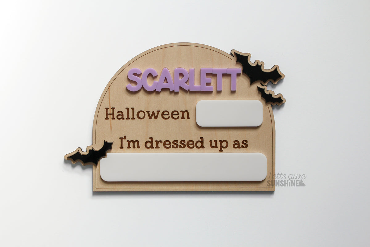 Personalized Halloween costume photo prop with child’s name, black bats and dry erase spaces for the year and costume