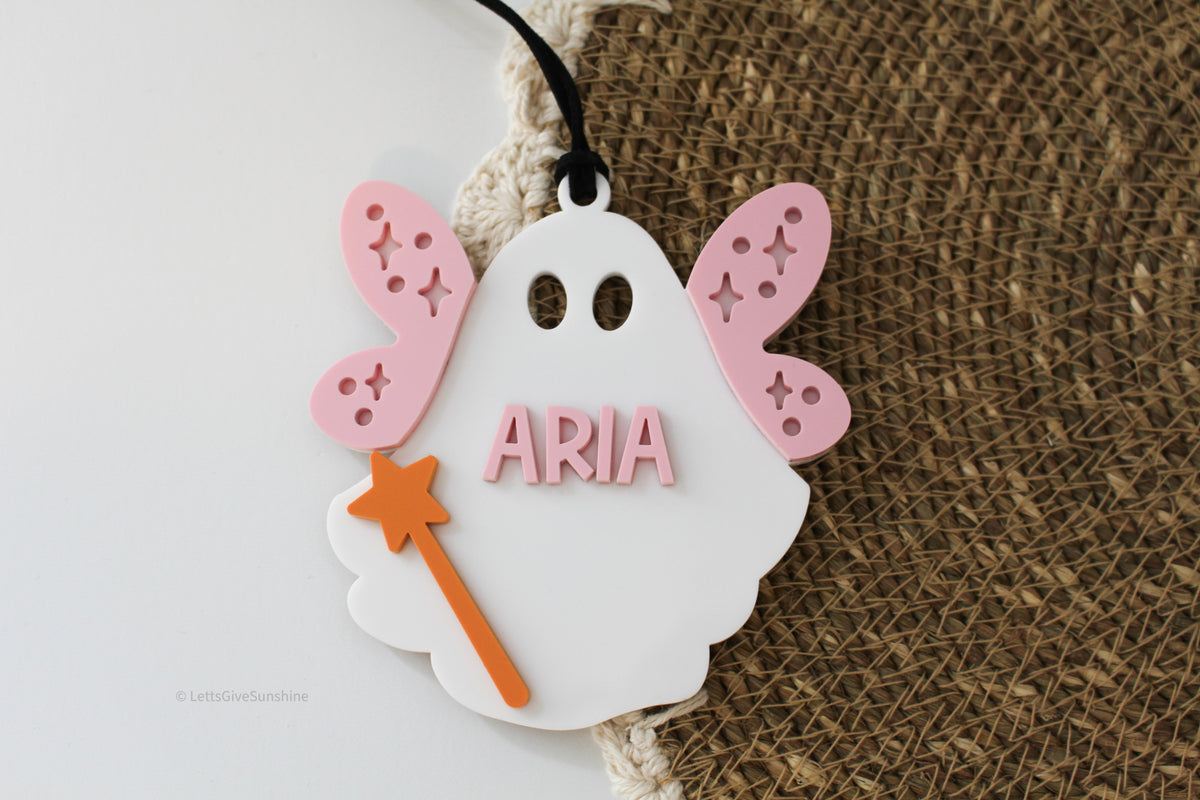 Personalized fairy ghost Boo Basket tag with pink wings, orange star wand and child’s name on a white ghost Halloween tag
