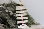 Custom wooden family Christmas ornament in neutral colours, featuring personalized name signs, Santa Stop Here design, and 2026 keepsake detail