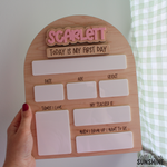 Personalized wooden first day of school milestone board with pink raised acrylic name Scarlett, Interchangeable “Today Is My First Day” " Today Is My Last Day" tiles, and dry erase spaces for date, age, height, teacher, favourite things, and future dream.