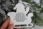 Back of interactive Santa Tracker ornament featuring instructions to tap with an NFC smartphone and follow Santa's journey on Christmas Eve.