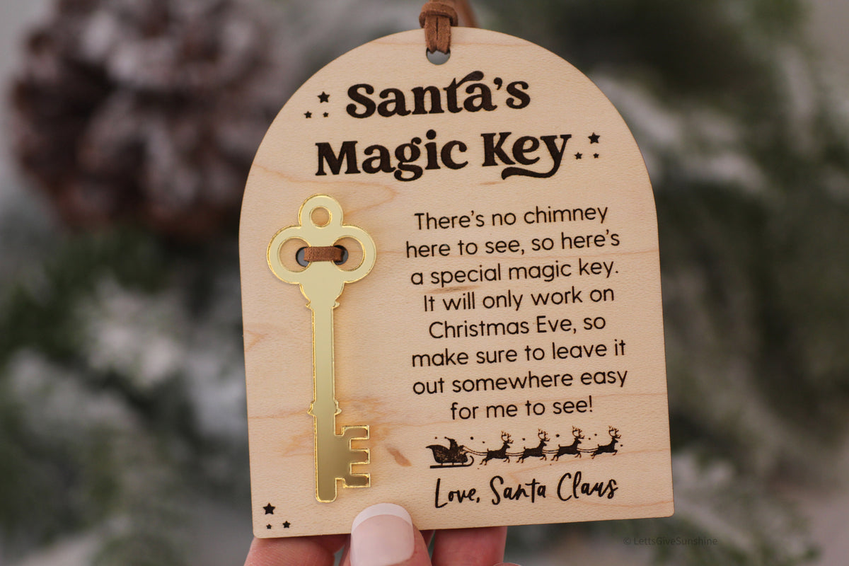 Santa's Magic Key Christmas tradition plaque with attached gold key, decorative stars, Santa's sleigh and reindeer, and engraved holiday message