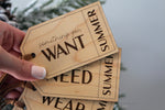 Reusable personalized Christmas gift tags made from natural wood, showing Want, Need, Wear and Read categories for children's holiday presents.