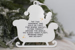 Back of interactive Santa Tracker ornament featuring instructions to tap with an NFC smartphone and follow Santa's journey on Christmas Eve.