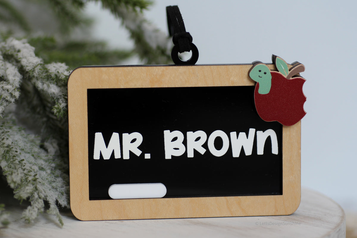 Custom teacher name Christmas ornament made from layered wood and acrylic with black chalkboard, raised white Mr. Brown lettering and apple decoration
