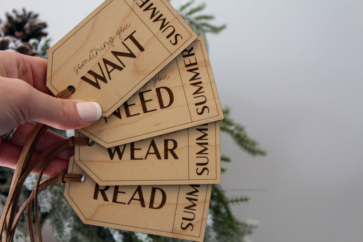 Reusable personalized Christmas gift tags made from natural wood, showing Want, Need, Wear and Read categories for children's holiday presents.