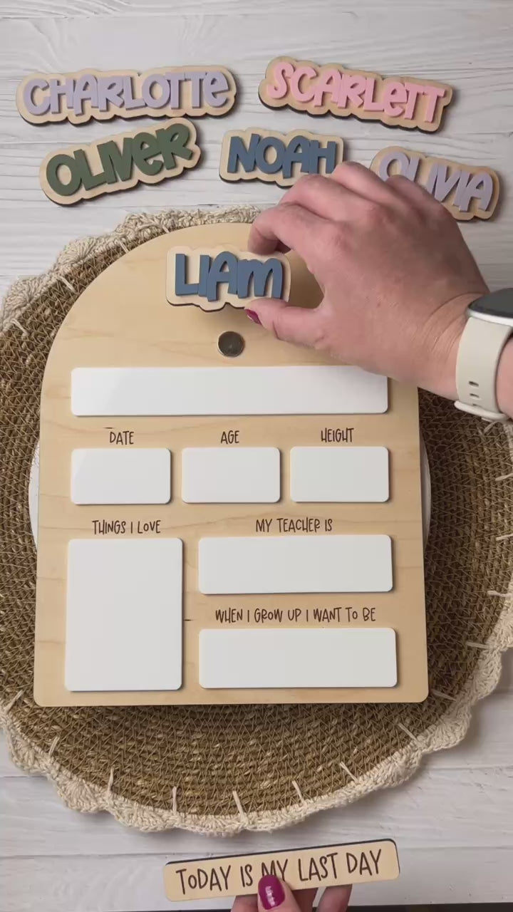Personalized wooden first day of school dry erase milestone board showing the interchangeable pieces